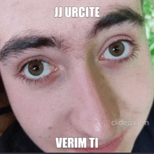 a close up of a person 's face with the words jj urcite verim ti on it