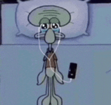 squidward from spongebob squarepants is crying while listening to music on his cell phone .