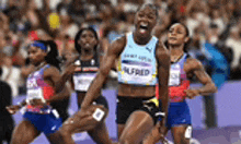 a group of female athletes are running on a track in a race .