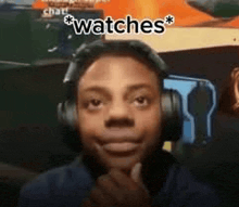 a man wearing headphones is making a funny face while looking at the camera .