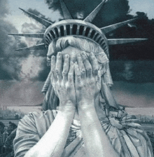 statue of liberty covering her face with her hands