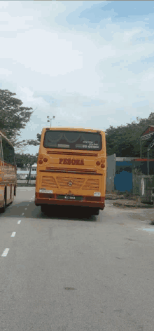 a yellow bus that says pesona on the back of it