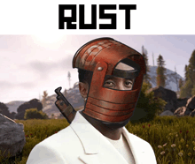 a man wearing a rust helmet is standing in a field