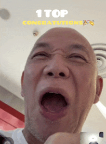 a picture of a man with his mouth open and the words 1 top congratulations above him