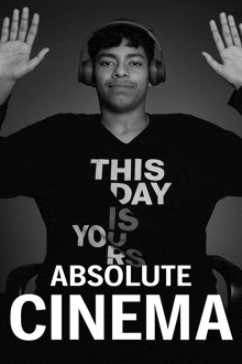 a black and white photo of a man wearing headphones and a shirt that says this day is yours is absolute cinema
