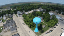 an aerial view of mt pulaski with a water tower