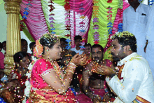 a bride and groom are showered with confetti during their wedding