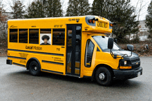 a yellow school bus that says local motion on the side of it