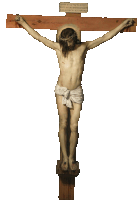 a statue of jesus hanging on a cross with a sign that says ' jesus ' on it