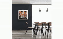 a dining room with a painting on the wall above the table and chairs