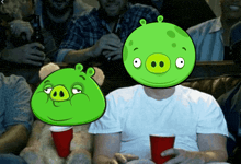 a group of men sitting on a couch with angry birds on their heads