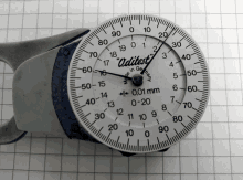 a aditest made in germany measuring device is on a piece of graph paper