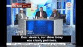 three men sit in front of a screen that says memri tv