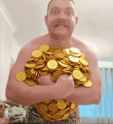 a shirtless man holding a pile of gold coins