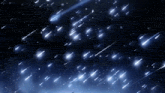 a night sky with a lot of shooting stars falling