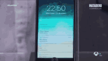 a phone screen shows the time as 22:50