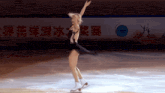 a female figure skater is performing in front of a sign that says world championship