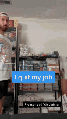 a man is standing in front of a shelf with a sign that says " i quit my job "