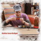 a picture of a man playing with a toy train with the caption sheldon loves shelly 3 on the bottom