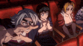 a group of anime characters sitting in a theater watching a movie