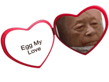 a heart shaped mirror says egg my love