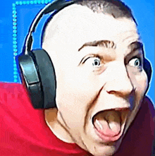 a man wearing headphones making a funny face