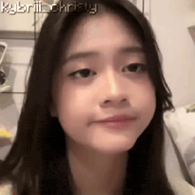 a close up of a girl 's face with the name kylbrill christy written above her