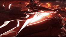 a woman with long red hair is holding a sword