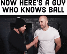 two men standing next to each other with the words now here 's a guy who knows ball