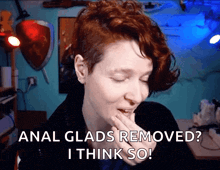 a woman covering her mouth with her hand and the words " anal glads removed i think so "