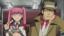 a man and a girl are sitting next to each other and the girl is holding a sign that says ' ao '