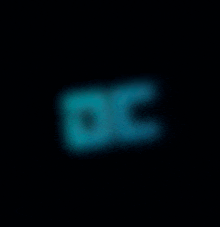 a blurred image of the word oc on a black background