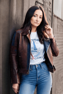 a woman wearing a t-shirt with the word malibu on it