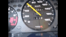 a close up of a car 's speedometer shows that the car has reached 160 km / h