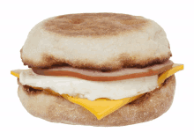 an english muffin sandwich with ham and cheese on a white background