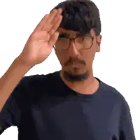 a man wearing glasses and a black shirt salutes