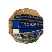 a brick building with a blue sign that says th on it
