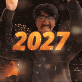 a man with glasses and a mustache holds his fist up in the air with the year 2027 written above him