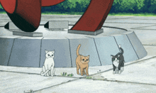 three cats are standing on a sidewalk in front of a red sculpture