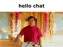 a man in a red shirt is holding a basket of food in front of a wooden building with chinese writing on the walls