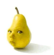 a yellow pear with a face painted on it is sitting on a white surface .