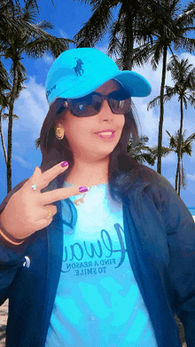 a woman wearing a blue hat and a blue shirt with the word soul on it