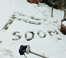 the word soon is written in the snow in front of a satellite dish