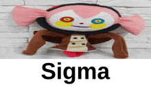 a stuffed animal named sigma is sitting on a table