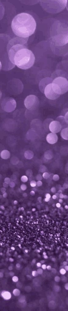 a purple background with a lot of purple glitter on it