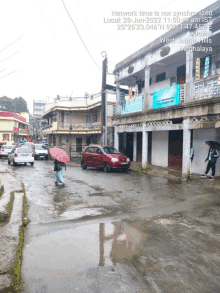 a photo of a street with the words network time is not synchronized at the bottom