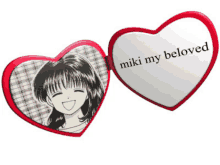 a heart shaped mirror with a picture of a girl and the words " miki my beloved "