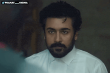 a man with a beard wearing a white shirt has a twitter account named pranay_varma