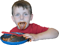 a young boy in a red shirt is eating from a blue plate with a red fork