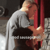 a man is holding a sausage roll in front of a red curtain with the words " good sausage roll " below him